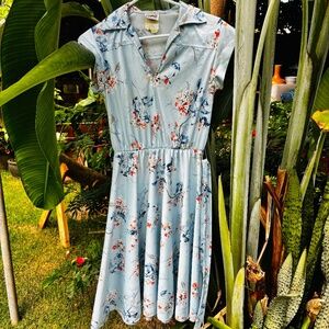 soft sleeveless blue floral dress with cloth belt and collar